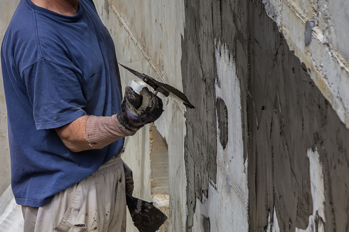 a professional sealing cracks in basement wall