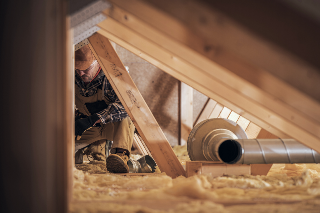 technician performing attic services