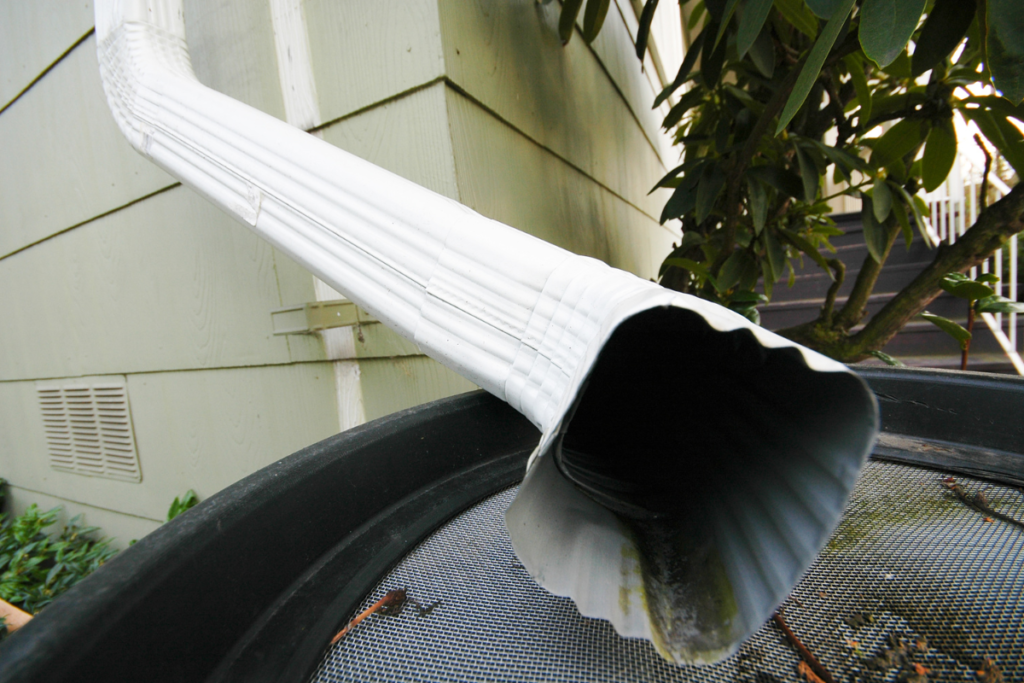 gutter downspout extension installation as home improvement to save money