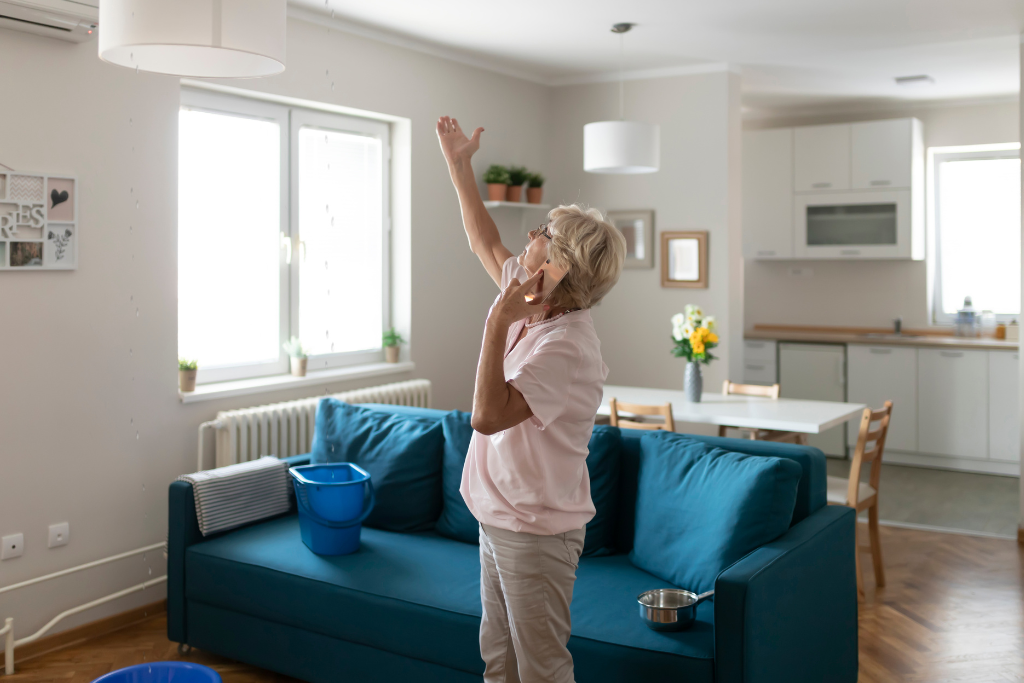 woman wondering why her house is leaking, a common misconception that it couldn't be due to poor moisture management