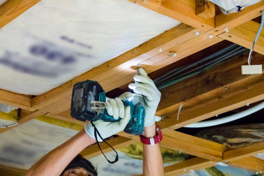 man performing diy crawlspace repair
