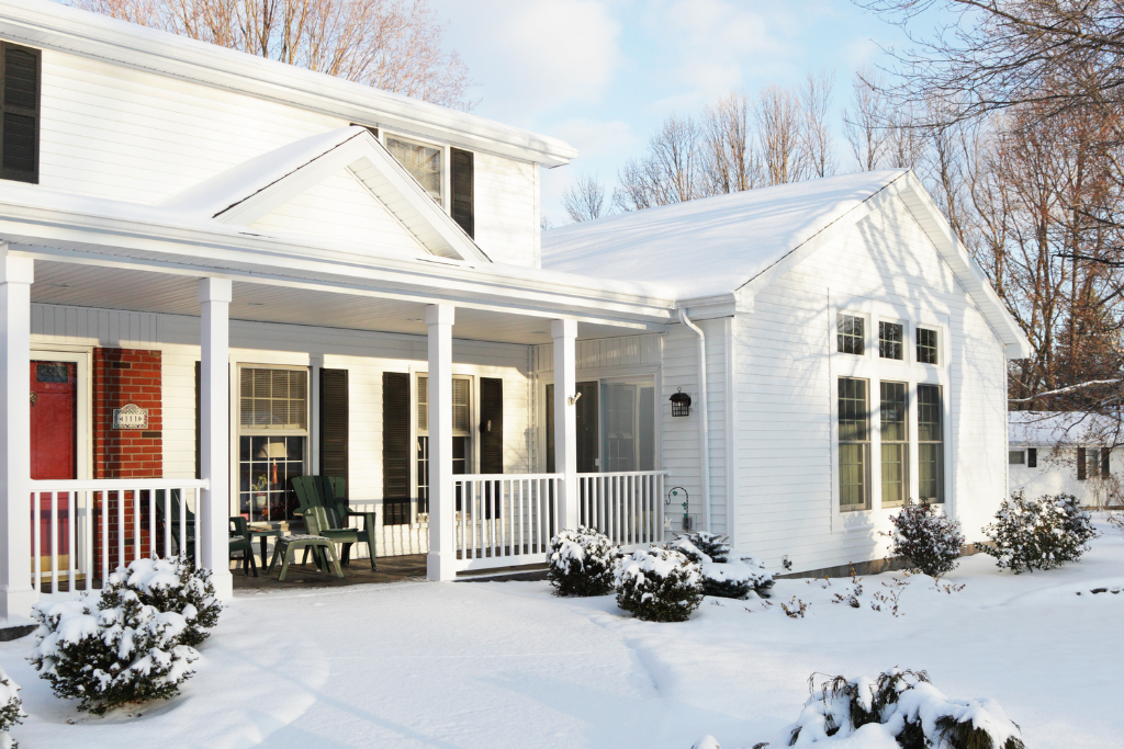 house covered in winter weather snow