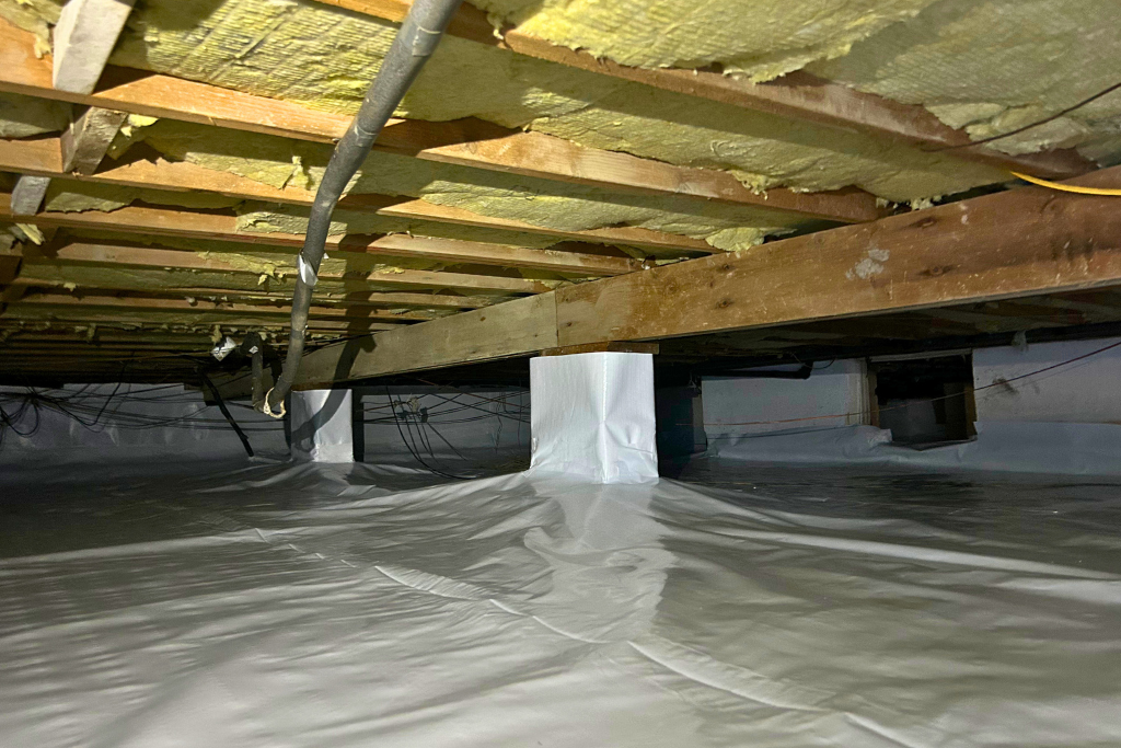 vapor barrier in crawlspace on the floor, walls, and pillars